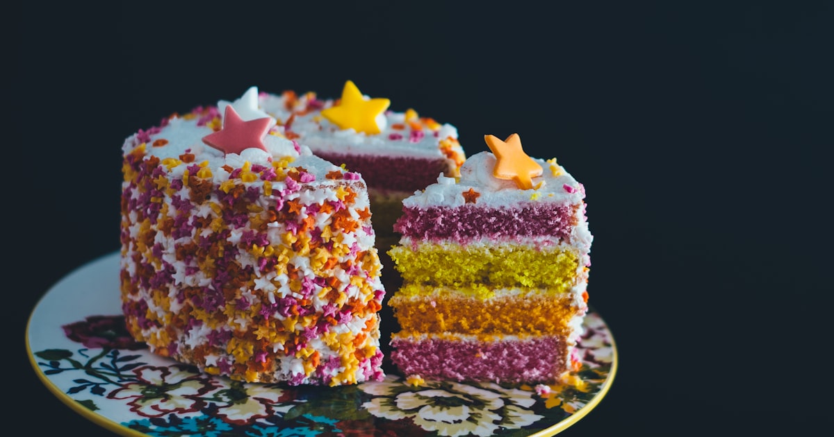 Illustrated birthday scrapbook page with cake and confetti