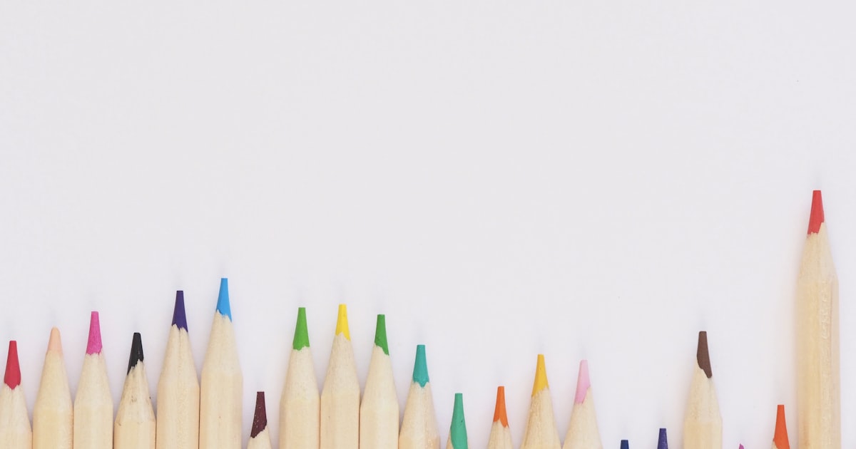 Disney scrapbook album spread with park maps, ticket stubs, and character-themed papers