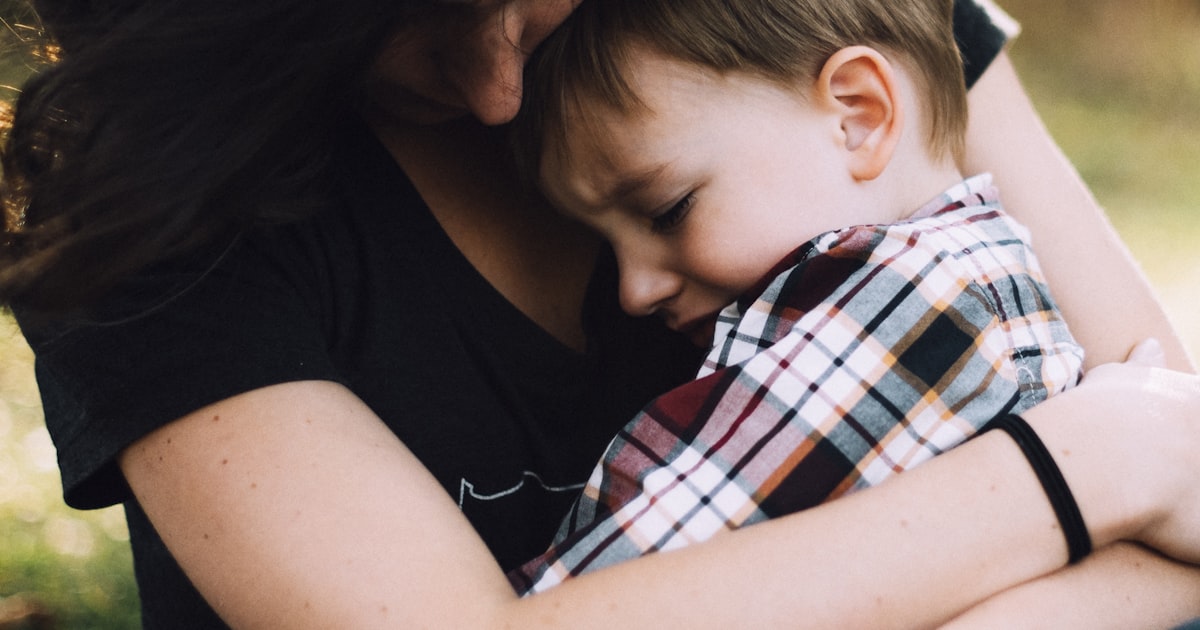 Old family photographs and documents spread on a table for heritage scrapbooking